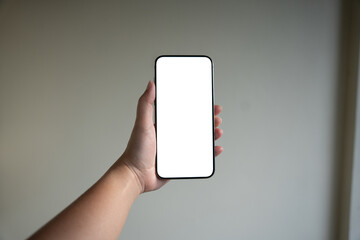 Smart phone mockup. Women hands holding cell telephone blank copy space screen smartphone blank white screen isolated technology concept.