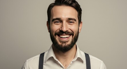 Obraz premium Cheerful Man with Beard and Suspenders Smiling