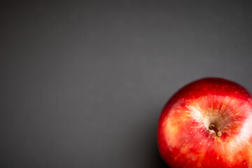 red delicious apple on black background