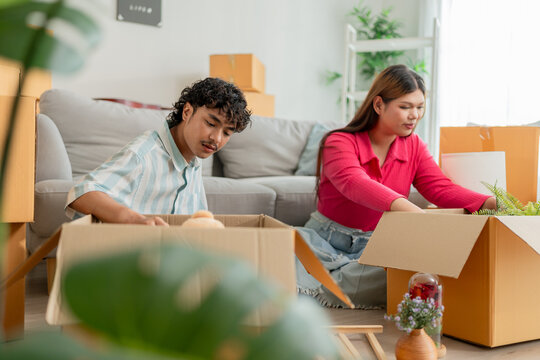 Asian transgender woman and male partner moving to new house together. - Powered by Adobe