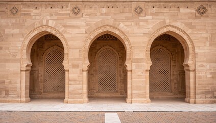 Naklejka premium Ornate islamic architecture facade with three horseshoe arches detailed stone carving