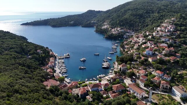 Aerial Drone View of Kioni Village, Ithaca, Greece, Traditional Harbor and Ionian Sea