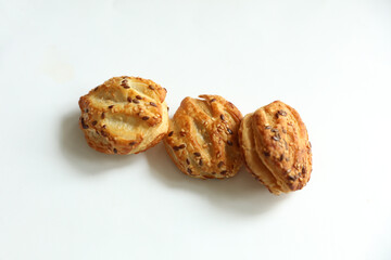 Mini pie with sesame seeds on white background