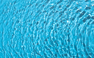 Wavy water texture on blue background