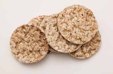 Rice round crackers, diet bread on white background