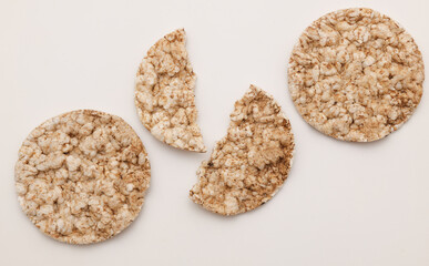 Rice round crackers, diet bread on white background