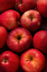 Fresh red apples forming appealing composition on dark background