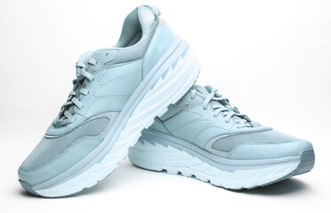 Pair of blue leather running shoes isolated on white background