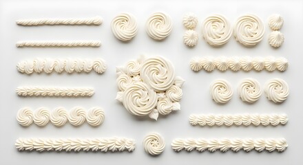 Assorted frosting swirls on white background