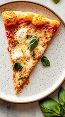 Slice of margarita pizza with tomato sauce, fresh basil on a speckled plate