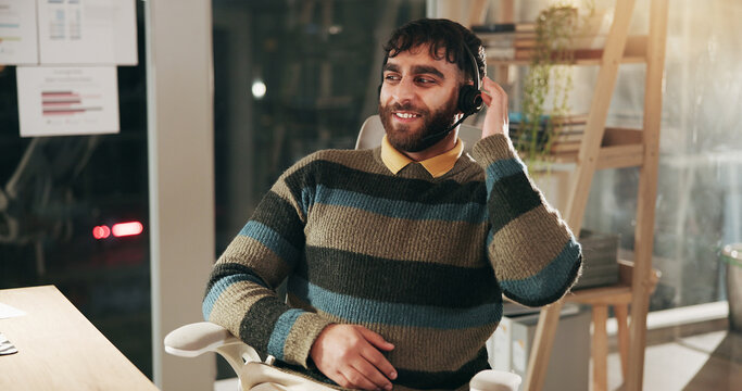 Call center consultant, night and smile with man for investment advice, finance or loan. Headset, listening and contact us with agent for banking assistance, charts and crm analysis on overtime - Powered by Adobe