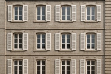Fototapeta premium Windows' Architectural Symmetry: A symmetrical composition of windows and shutters on an old building presents a classic architectural style. showcasing precision in design.