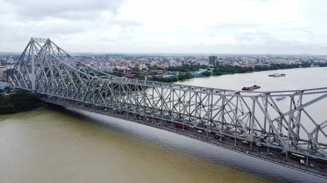 Aerial view of a indian bridge over a indian river Hooghly. 
Howrah Bridge (Rabindra Setu).