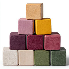 Fototapeta premium Colorful stacked wooden blocks in a pyramid shape.