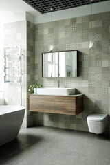 Modern bathroom interior featuring floating wooden vanity with rectangular sink, wall mirror reflecting window, freestanding bathtub, wall mounted toilet, patterned tile walls