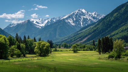 Lush valley nestled beneath snow-capped mountains
