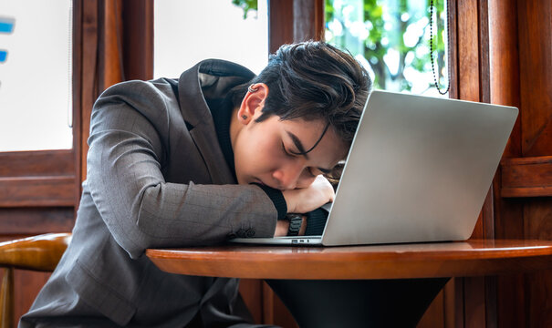 Caucasian businessman feeling tired and stress  from financial work