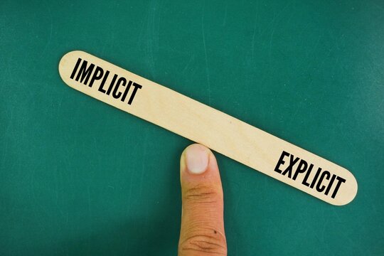 The balance between the words Explicit and Implicit. Explicit meaning is stated directly and clearly, leaving no room for doubt, while implicit meaning is understood through hints, suggestions.