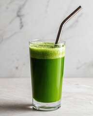 Vibrant Green Juice in a Glass with a Stainless Steel Straw