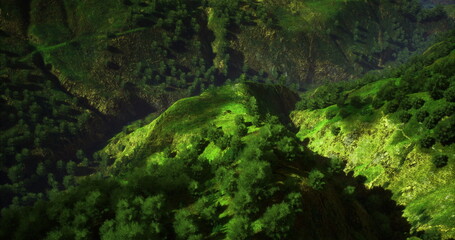 Bright sunlight illuminates rolling hills covered in vibrant green vegetation. A tranquil valley stretches below, showcasing the beauty of nature in a peaceful setting.