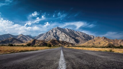 Mountain road under a vibrant sky