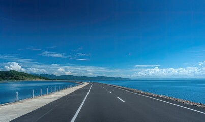 Fototapeta premium Coastal highway under a vibrant blue sky