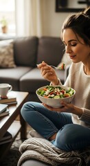 Woman enjoying a healthy salad at home, relaxed and cozy, promoting wellness and balanced lifestyle.
