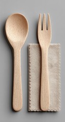 Wooden spoon and fork set on napkin