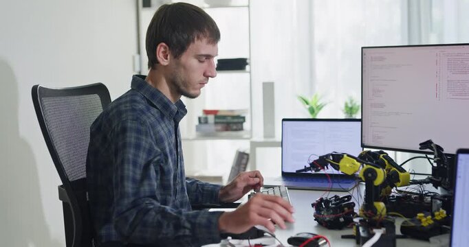 Team of male developers work code control robotics system and software automation project write prompt AI data bot at office. Artificial intelligence, collaboration, robotic, debugging, machine learn.