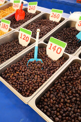 Variety of dried fruits displayed at a local market stall
