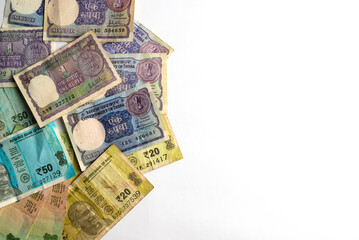 Vintage and Modern Indian Currency Notes on White Background