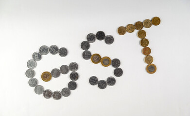 Coins Forming the Letters 'GST' Representing Goods and Services Tax Concept