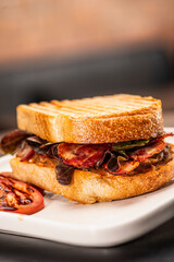 close up picture of grilled bacon sandwich