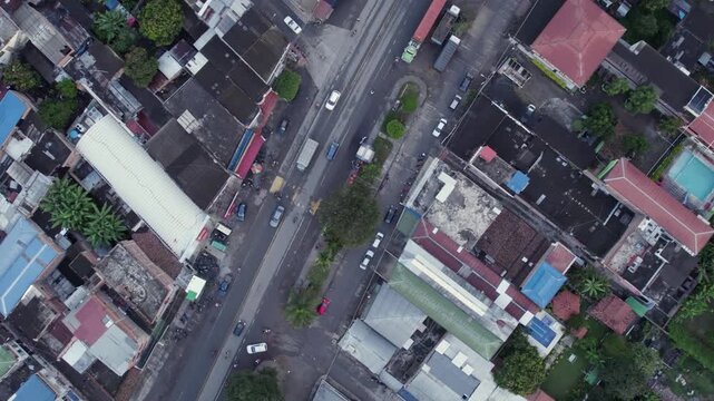 Aerial drone footage of El Placer corregimiento in El Cerrito Valle del Cauca Colombia showing rooftops and main road.