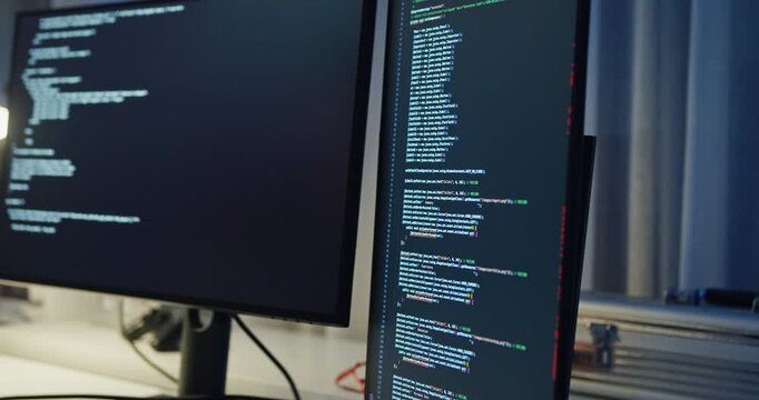 Closeup team adult male engineer collaborate on robotic hand project use AI code solutions machine learn at tech workspace night. Artificial intelligence interface collaboration prototype development.