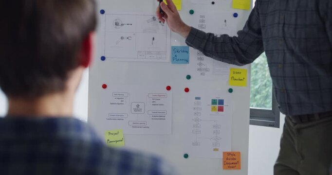 Closeup team adult male engineer develop present AI robotics hand project at tech workspace. Artificial intelligence, collaboration prototype development, robotic, debugging, machine learn, training.