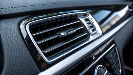 Car Air Vent: A close-up shot of the interior car detailing showcases the sleek design of an air vent. Capturing the essence of automotive luxury and functionality.