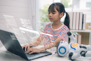 Asian girl learning coding and programming on laptop with robot toy and digital interface, concept of STEM education, artificial intelligence, and future technology for kids.