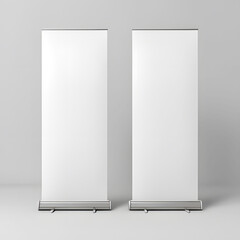 Two blank white roll up banners on a light gray background