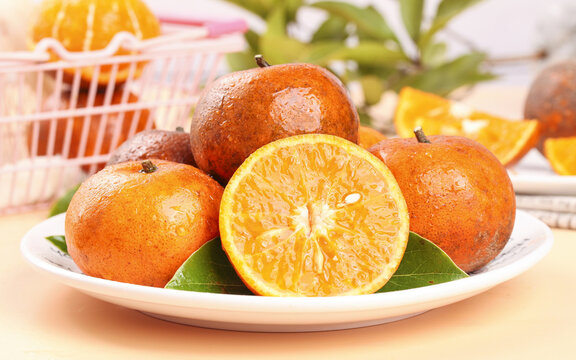 Freshly Picked Orange Citrus Fruits from Guangxi Highland Region on White Plate - Powered by Adobe