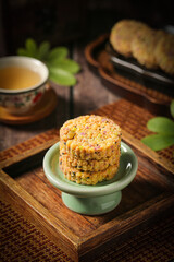 Hakka Stuffed Nut Cakes with Toasted Sesame Seeds - Traditional Chinese Pastries on Ceramic Stand