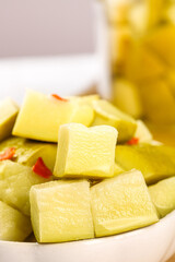 Pickled Sour Mango Pieces from Guangxi China - Traditional Crispy Preserved Fruit Snack in Bowl