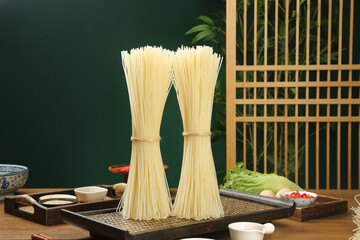 Handmade Rice Vermicelli Noodles Display with Traditional Guilin Asian Cooking Ingredients on...