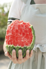 Fresh Watermelon with Bite Taken Out Held in Hand - Summer Fruit Snack