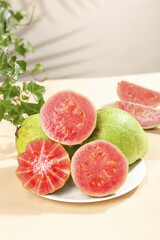 Fresh Red Heart Guava Fruit Sliced on Plate with Soft Cream Flesh from Guangxi Tree