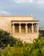 Fototapeta premium Ancient temple facade with statues, overlooking city