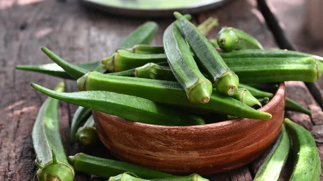 Green okra in wooden bowl prepare for cooking, Organic vegetables. Fresh green okra, Organic vegetable, Asian food ingredients