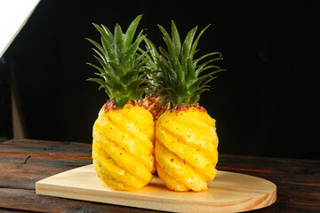 Fresh Golden Diamond-Cut Pineapples on Wooden Board - Tropical Hainan Fruits Ready to Eat