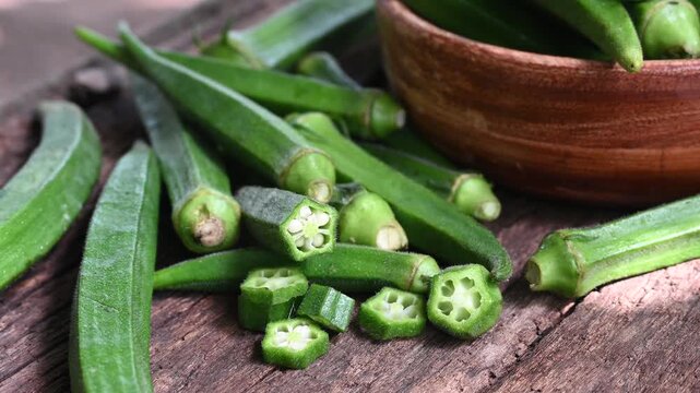 Green okra in wooden bowl prepare for cooking, Organic vegetables. Fresh green okra, Organic vegetable, Asian food ingredients