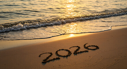 Serene Beach Sunrise with 2026 Written in Sand and Ocean Waves Symbolizing New Year and Fresh Beginnings"